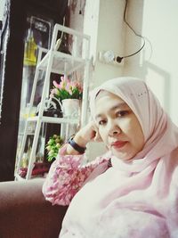 Portrait of woman looking at home