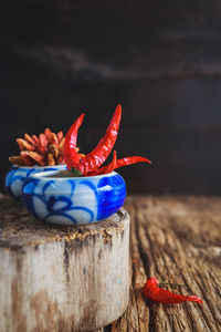 Close-up of red chili peppers on table