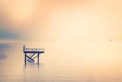 Wooden pier against sky during sunset at lake constance