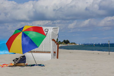 People on beach against sky
