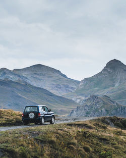 Car on mountain against sky