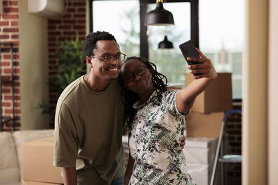 Portrait of young man using mobile phone