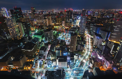 High angle view of illuminated city buildings at night