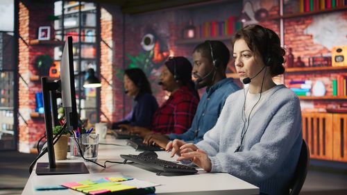 Young woman using laptop at table