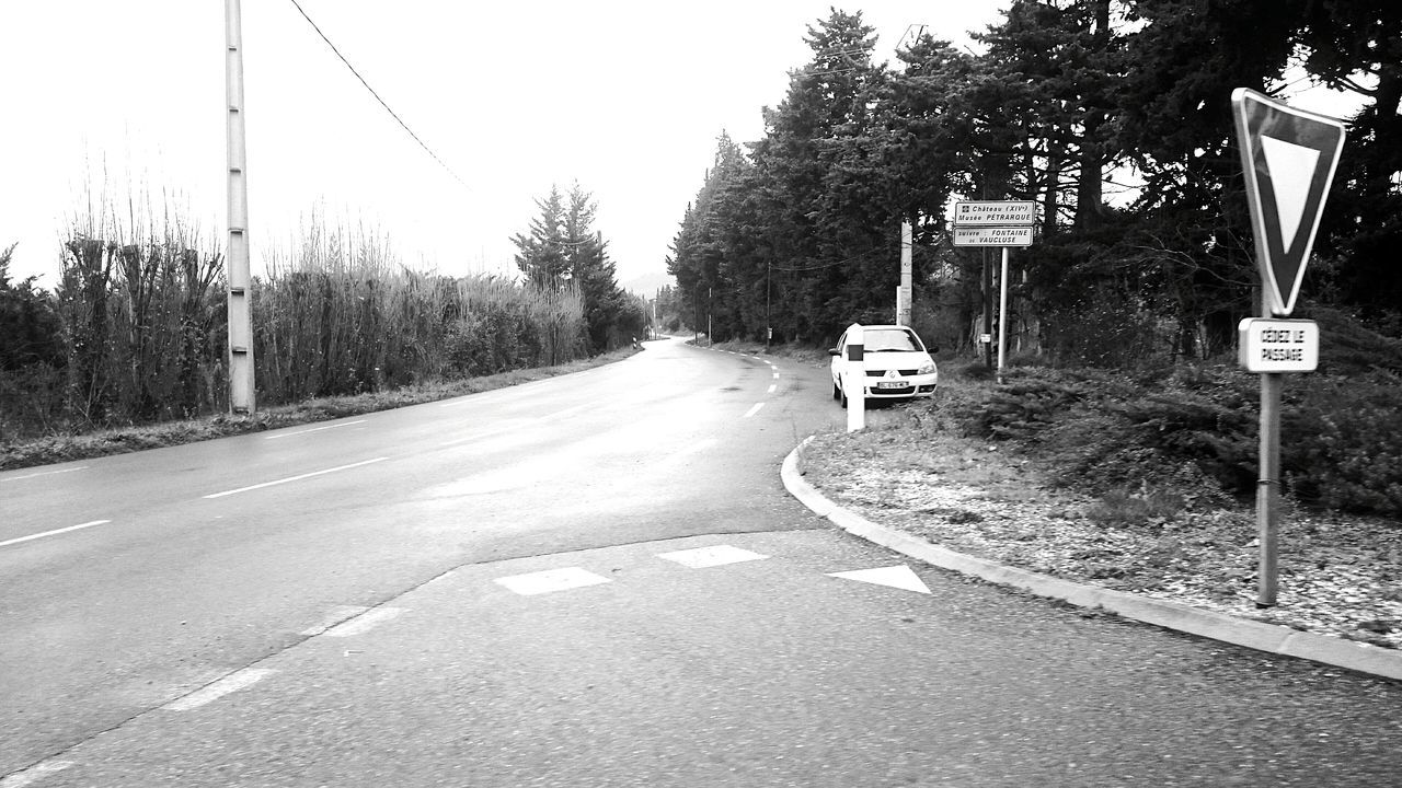 transportation, the way forward, road, tree, road sign, mode of transport, street, land vehicle, diminishing perspective, guidance, road marking, car, clear sky, information sign, vanishing point, communication, asphalt, sign, day, outdoors