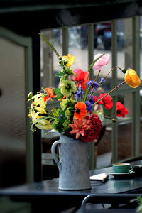 Close-up of flower vase on table at home