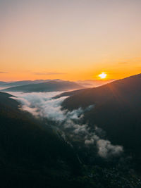 Beautiful sunrise in the carpathians with fog