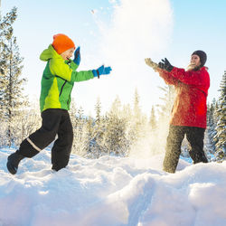 Mother with son playing at winter