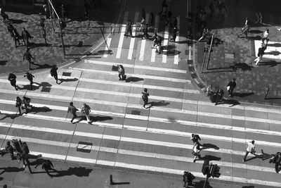 High angle view of people crossing road
