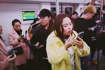 Group of people using smart phone