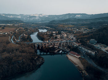 High angle view of river amidst buildings in town