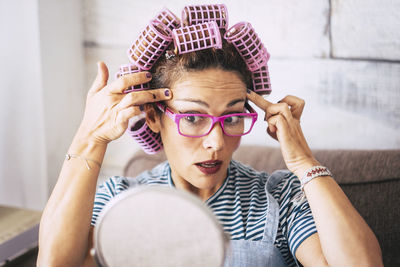 Portrait of young woman wearing eyeglasses