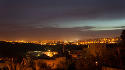 Illuminated cityscape at night