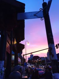 View of city street at sunset