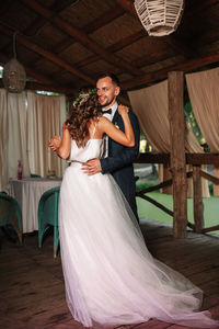 Newlywed couple dancing during wedding