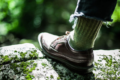 Low section of person on rock