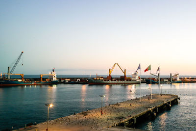 View of harbor at sunset