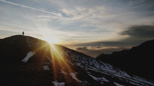 Scenic view of mountains against sky during sunset