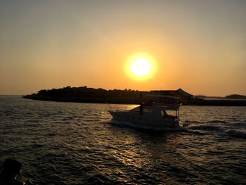 Scenic view of sea against clear sky during sunset