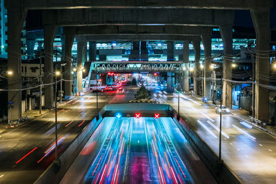 High angle view of light trails on road at night