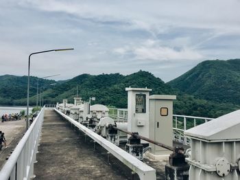 Machinery against mountains and sky