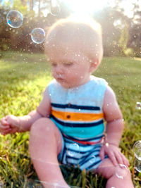 Boy playing with bubbles
