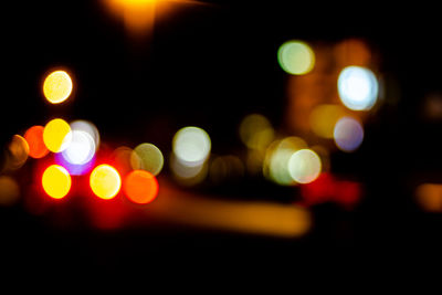 Defocused image of illuminated lights at night