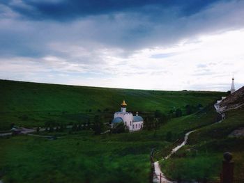 Scenic view of landscape against cloudy sky