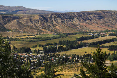 Scenic view of trees and mountains against sky