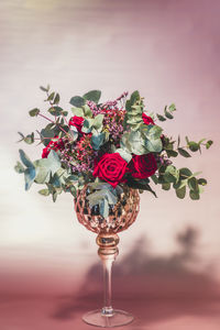 Close-up of red roses in vase on table