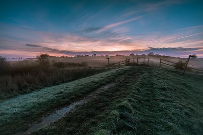 Scenic view of landscape at sunset