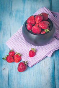 High angle view of strawberries in bowl on table