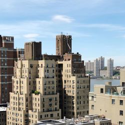 Buildings in city against sky