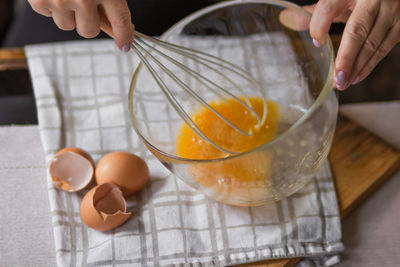 Midsection of person preparing food on table