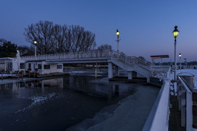 View of bridge in city against clear sky