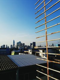 Modern cityscape against blue sky