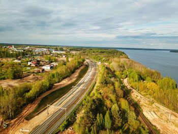 High angle view of road by sea against sky