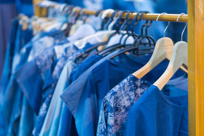 Close-up of clothes hanging on rack