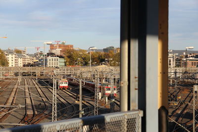 High angle view of train against buildings in city