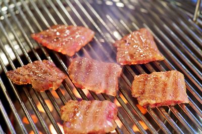 High angle view of meat on barbecue grill