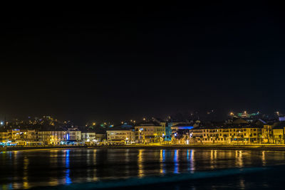 Illuminated buildings at waterfront