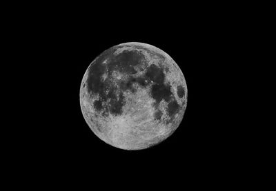 Close-up of moon against clear sky at night