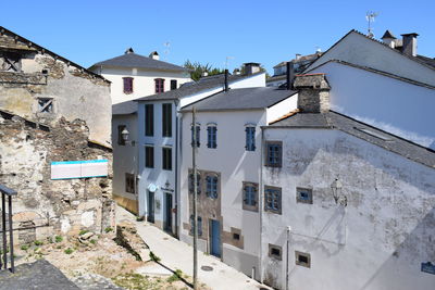 Residential buildings against blue sky