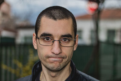 Portrait of man wearing eyeglasses