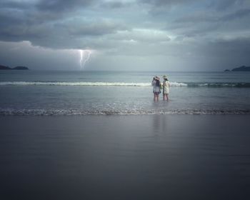 Scenic view of sea against cloudy sky