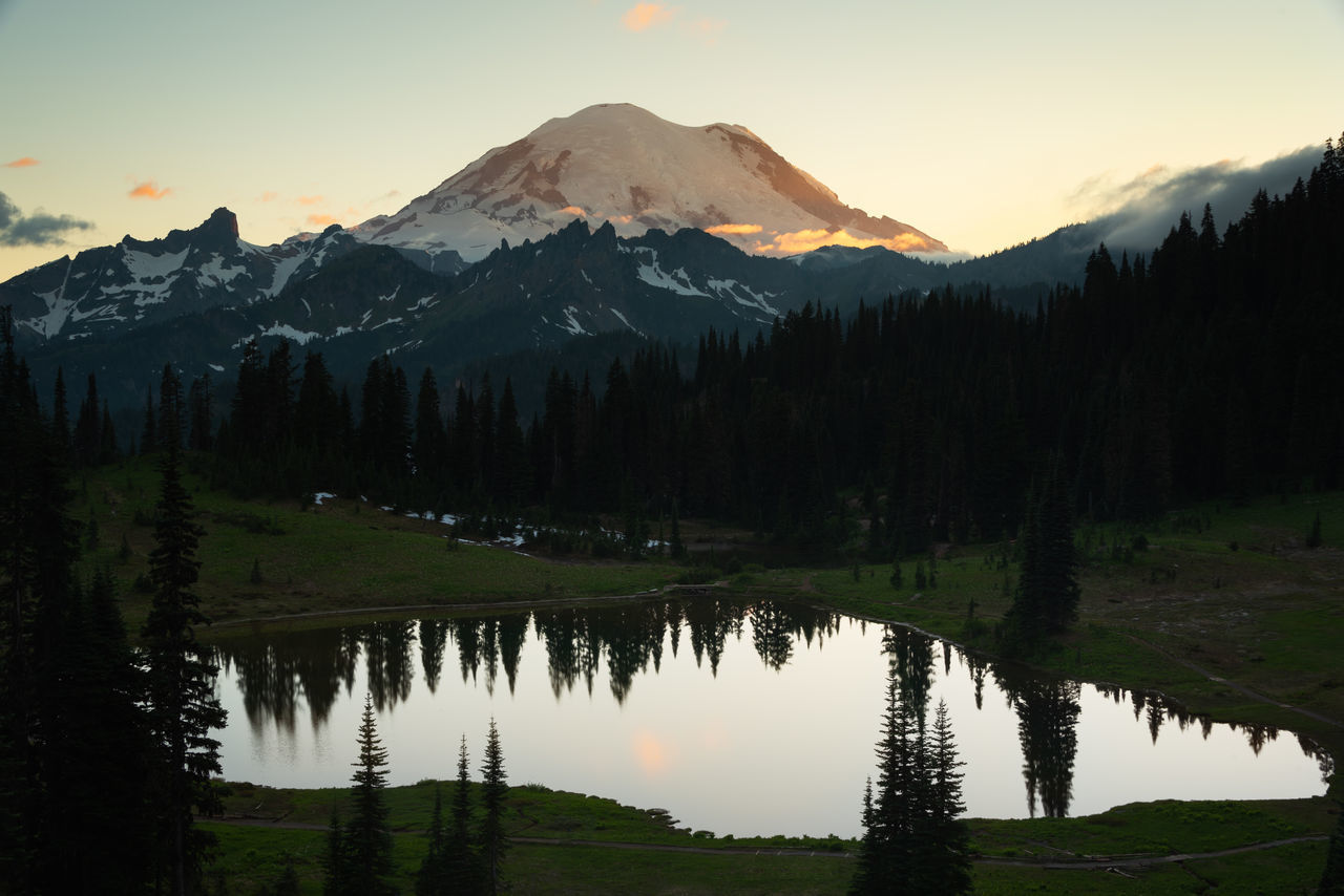 SCENIC VIEW OF LAKE AND MOUNTAINS DURING SUNSET