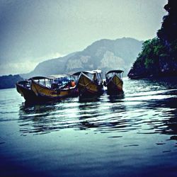 Scenic view of boats in lake