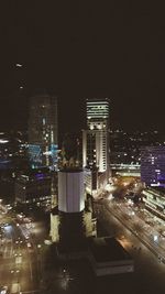 High angle view of city lit up at night