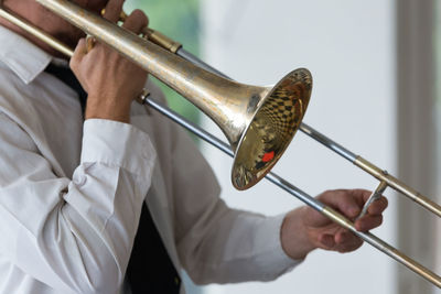 Close-up of man playing musical equipment