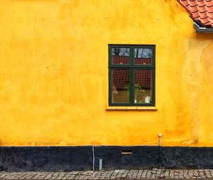 Close-up of yellow door of house